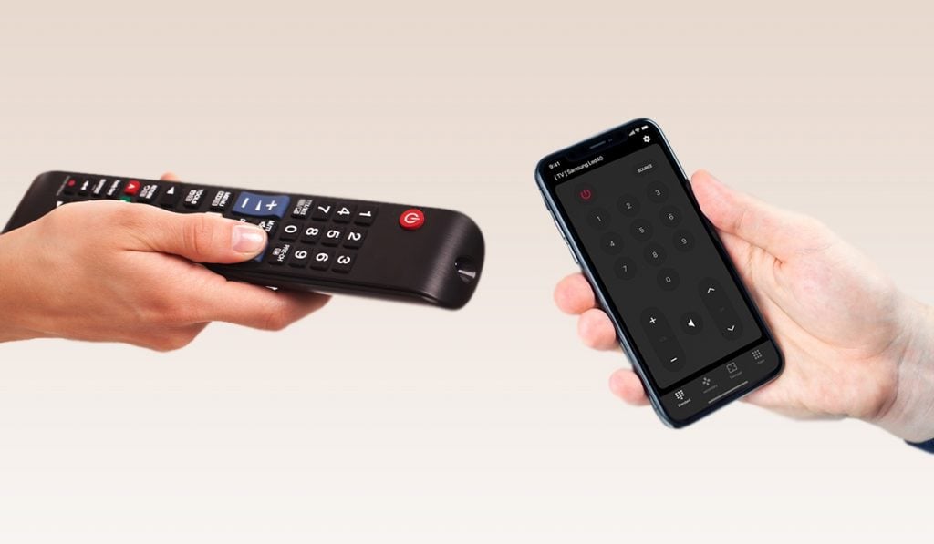 Two hands, one coming from the left side of the image, the other hand coming from the left side fo the image. The hand of the left side is holding a Samsung Tv remote. The hand on the right is holding an iPhone with ControlMeister app on the screen