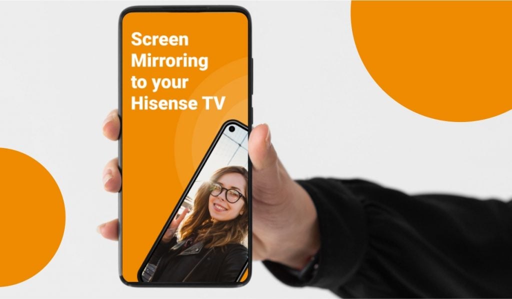 A hand holding a smartphone. The smartphone is displaying an orange screen with the header: "Screen Mirroring to your Hisense TV". There's an image of a woman posing for a selfie in front of a bridge on the screen.