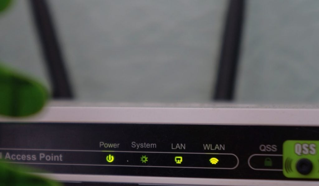 A router with a black panel and lights.