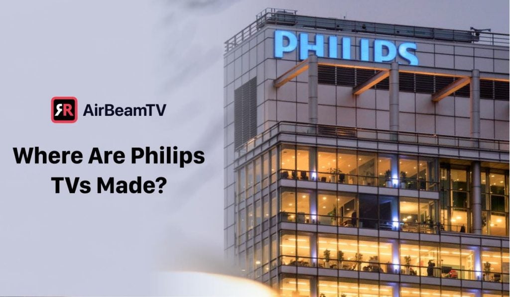 Philips office building with lights on. The header on the left side of the image says "Where are Philips TVs made?" and there's an airBeamTv logo above the header