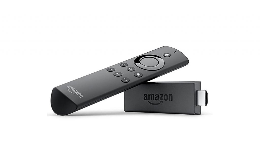 Fire TV stick and a Fire tV remote propped up on the stick