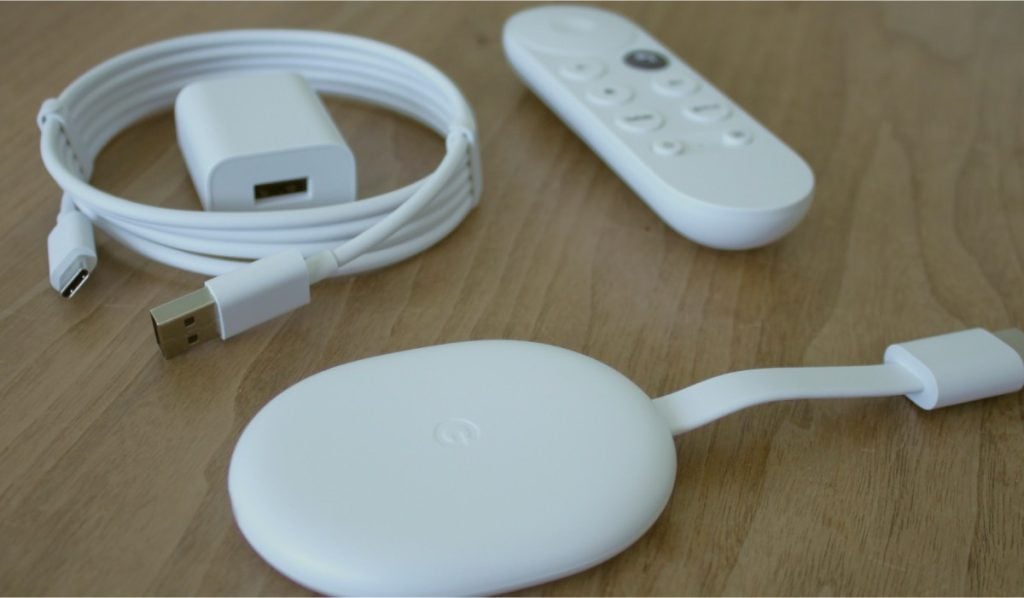 A Chromecast device, Chromecast remote and a power cable with a charging module.