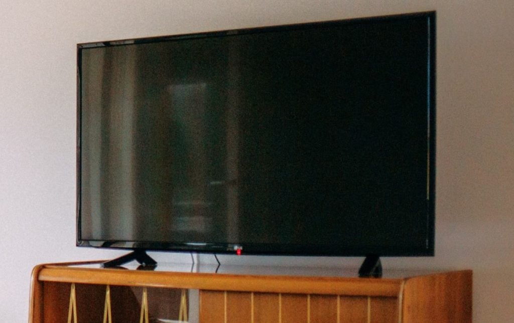 Lg Tv with a black screen on a drawer