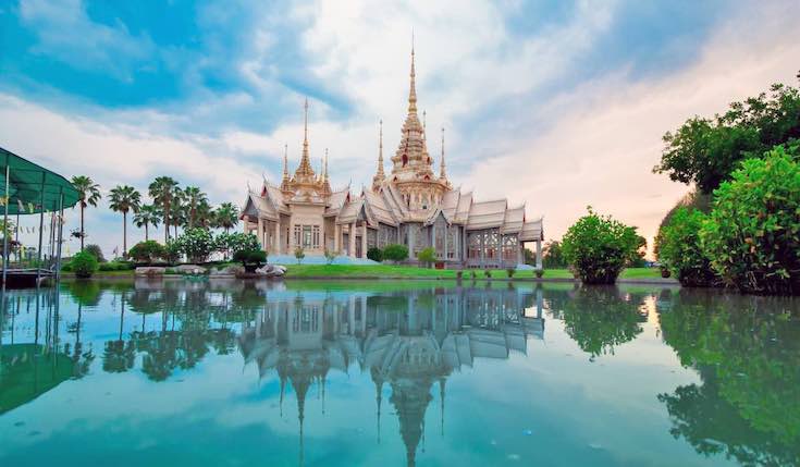 a temple by a body of water in Thailand