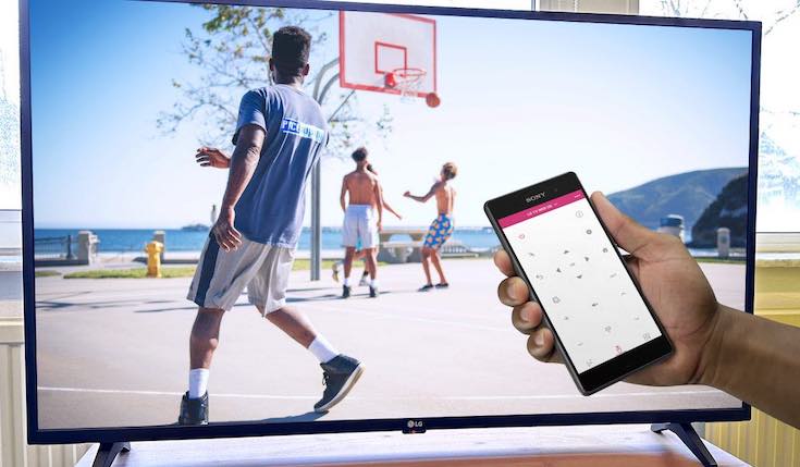 Basketball match on LG TV and a hand with an iPhone with LG TV remote app on the screen