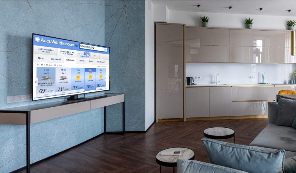 Accuweather app on Samsung TV in a modern, well-lit living room
