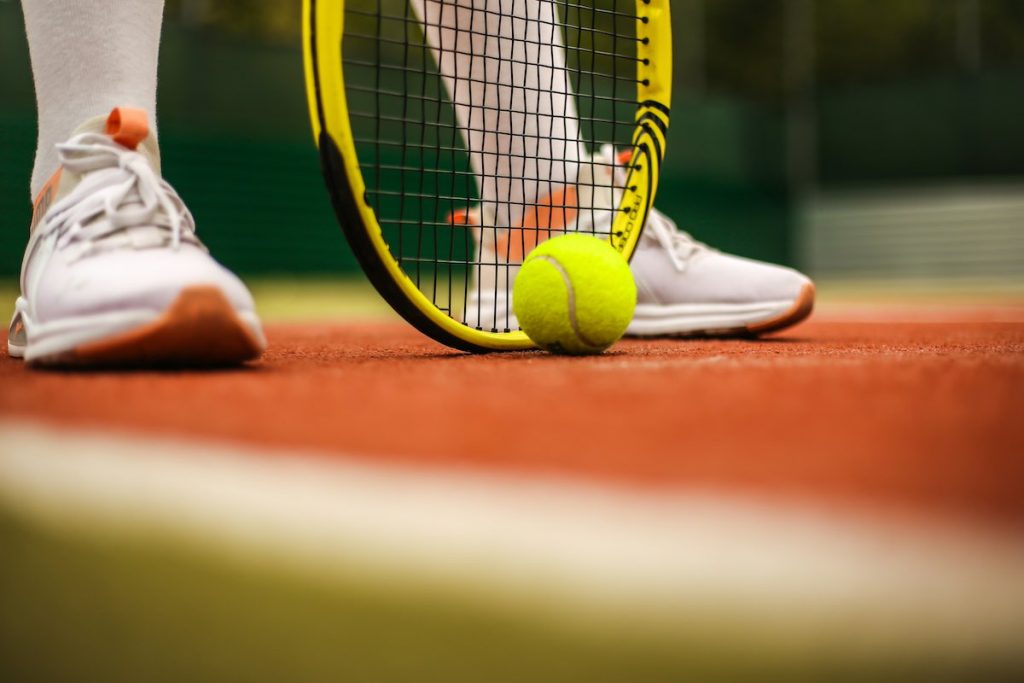 Tennis racket, ball, shoes
